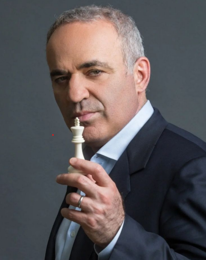 Garry Kasparov holding a chess piece