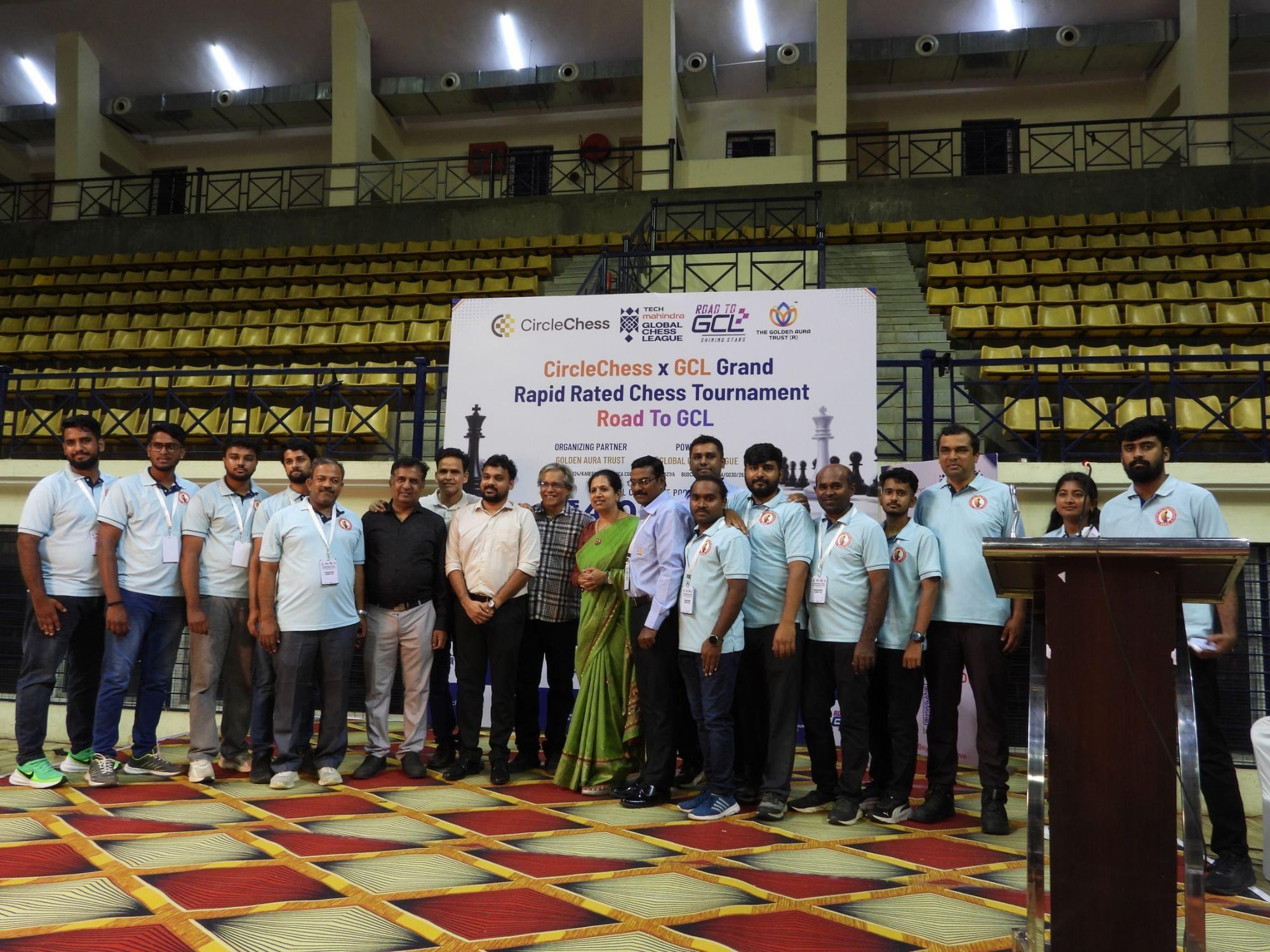 The arbiter team for the CircleChess x GCL Grand Open posing together on stage