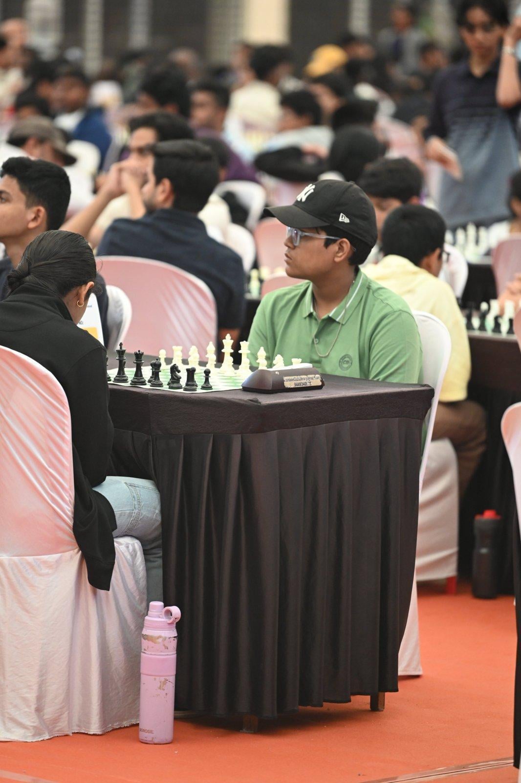 A player deep in concentration at the board during the CircleChess x GCL Grand Open