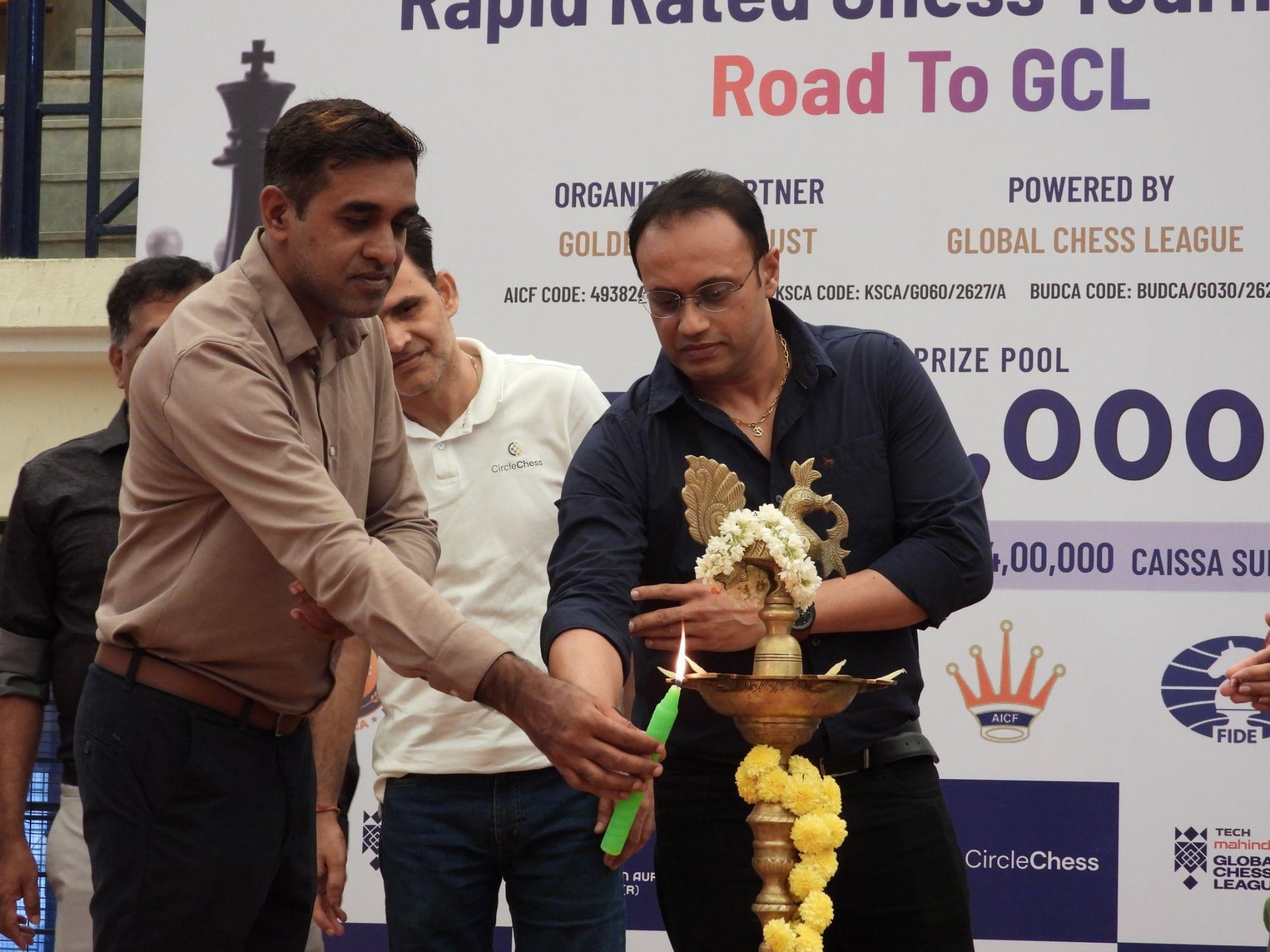 GM Tej Kumar and Mr. Prakash Nanjappa lighting the ceremonial lamp at the tournament's inauguration