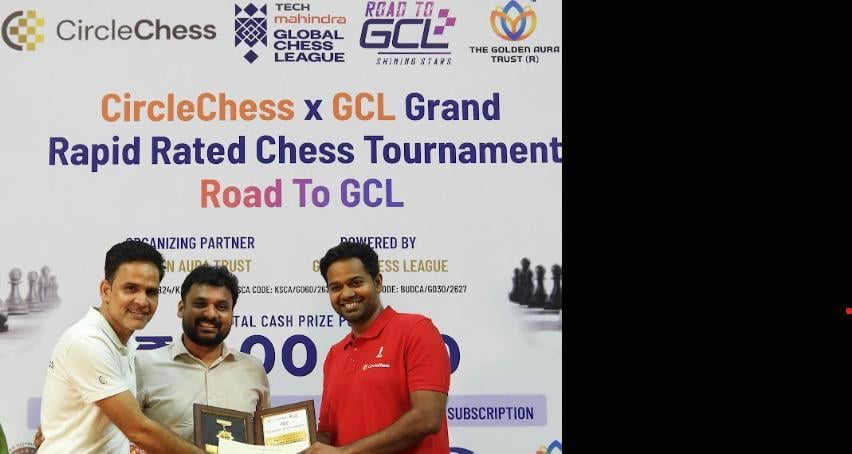 Three men smiling on stage after a prize handover at the CircleChess x GCL Grand Open